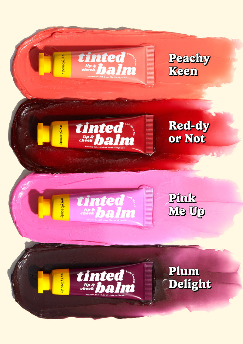 Four AvryBeauty Lip & Cheek Tinted Balms stacked on top of each other with swiped textures underneath, showcased on a light yellow background.