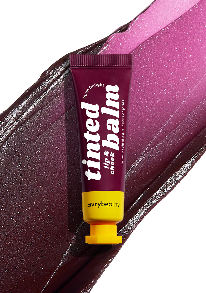 AvryBeauty’s Plum Delight Lip & Cheek Tinted Balm texture showcased smoothly on a clean white background, with the vegan makeup tube placed on top.