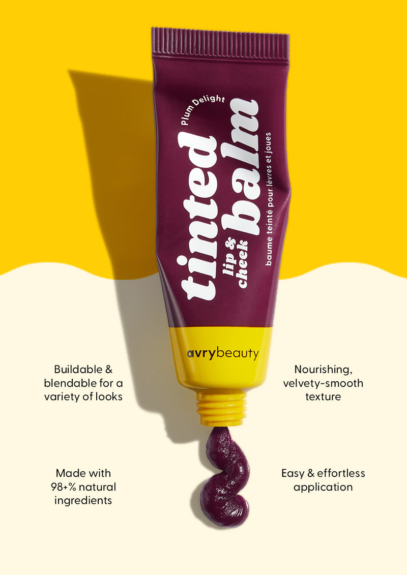 AvryBeauty’s Plum Delight Lip & Cheek Tinted Balm being squeezed out of its tube onto a beige and yellow background, with four callouts detailing its skin benefits.